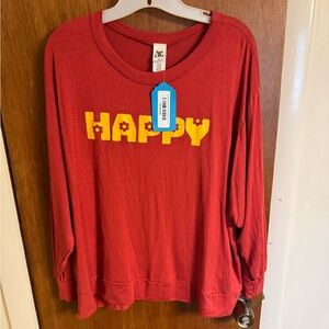 New with tags, ladies size medium rust colored long sleeve Happy graphic tee